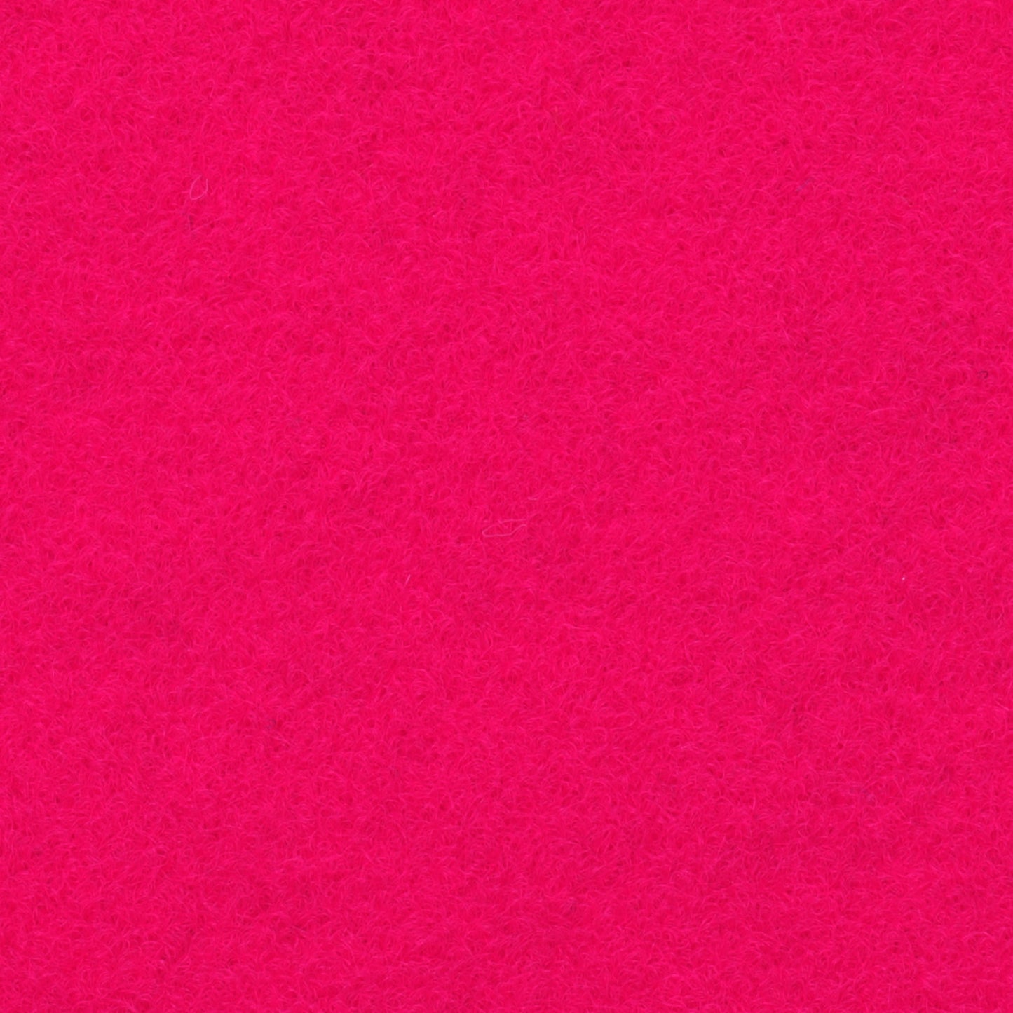 Ein leuchtend pinker, texturierter Filzteppich
