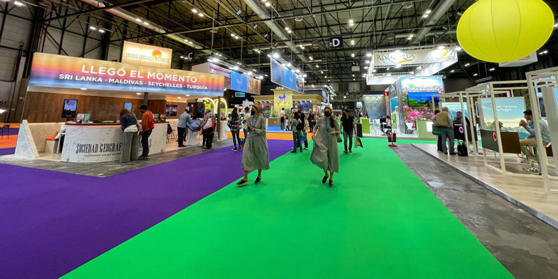View of a trade fair in Madrid with carpets in bright colors of green and purple
